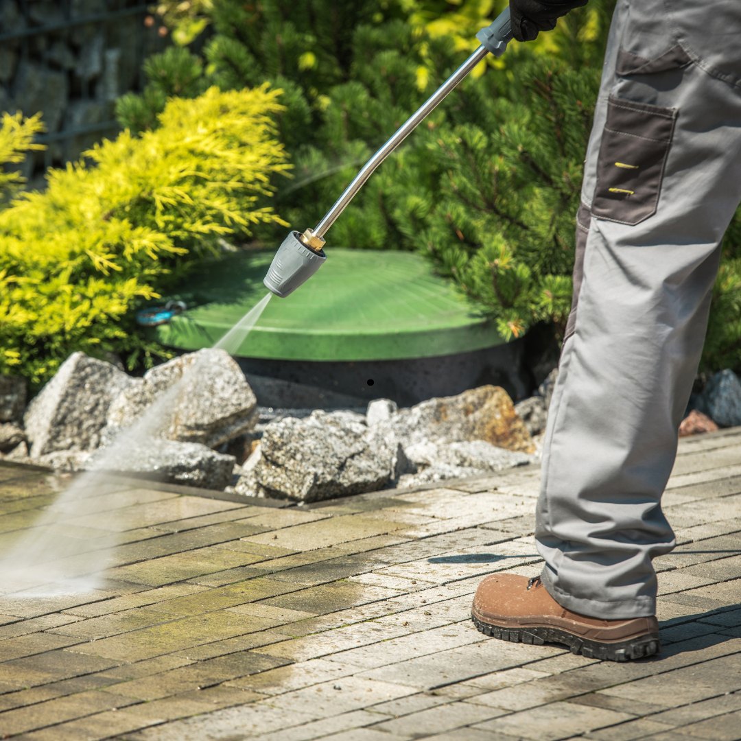 Pressure cleaning on an outdoor stone surface.
